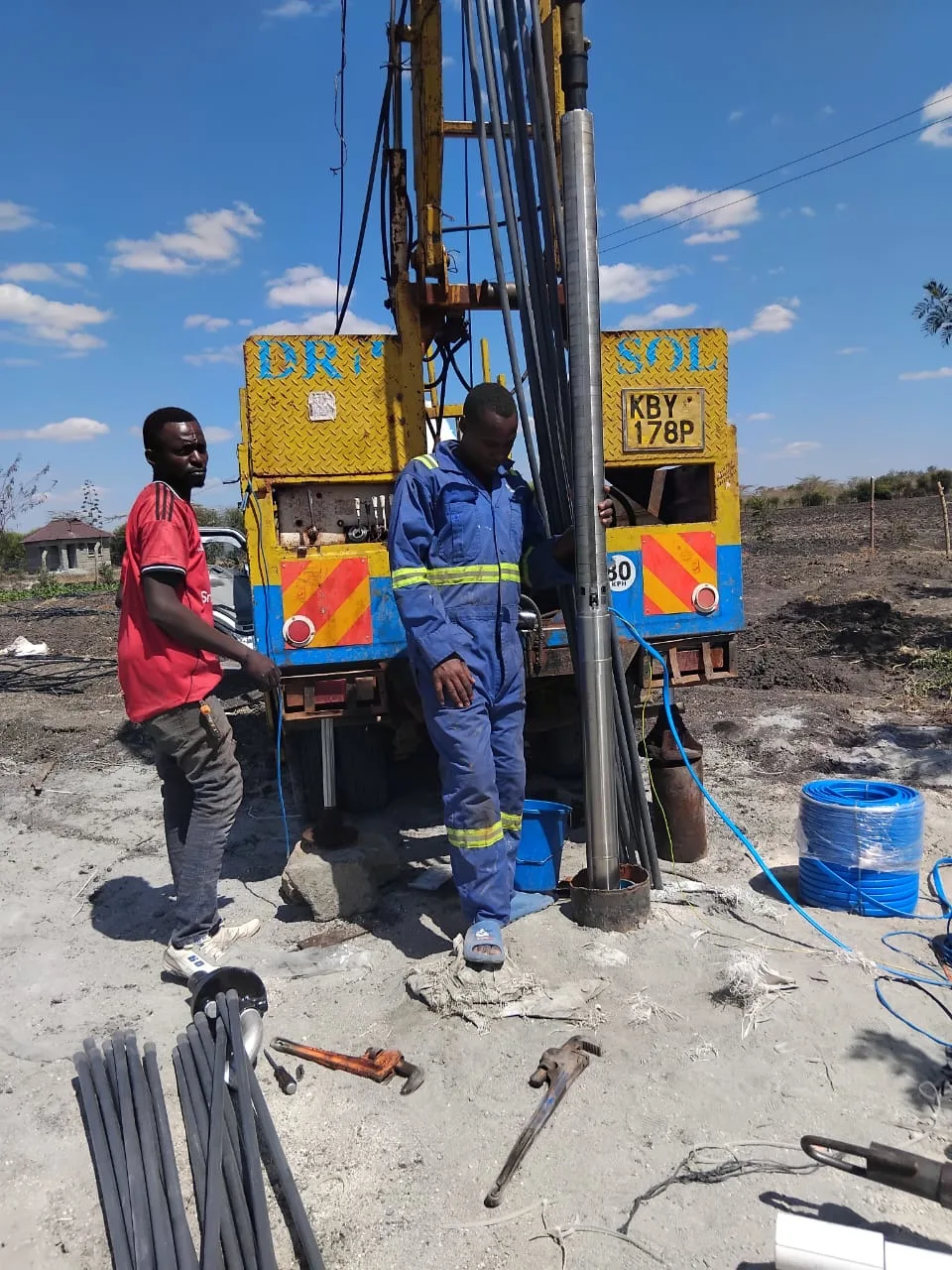 Professional borehole drilling equipment and team in operation